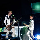 Muse Bassist 'Nearly Fainted' After Singing Live For First Time