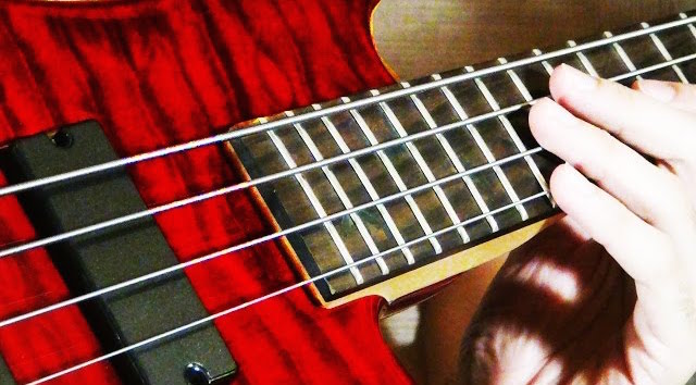 Watch: Dude Plays AC/DC Classics on Bass Tuned to A-C-D-C | Ultimate Guitar
