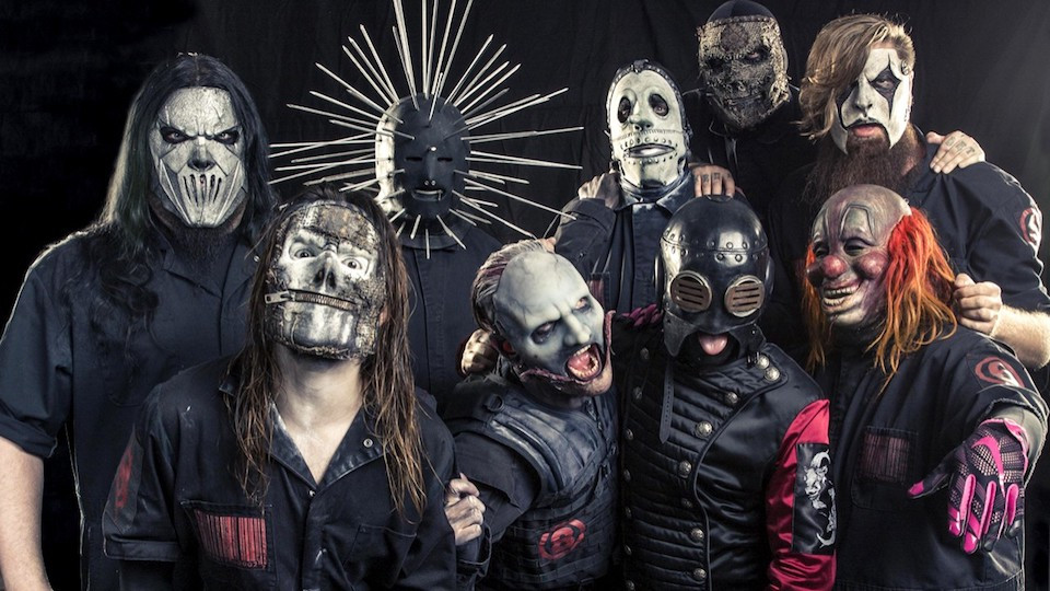 Slipknot is an American heavy metal band formed in Des Moines, Iowa, in 1995, globally renowned for its aggressive musical style, chaotic live performances, and distinct horror-themed masks. Emerging at the forefront of the late-1990s nu-metal wave, the group has earned a Grammy Award, sold millions of records globally, and established itself as an institution in modern extreme music with groundbreaking releases like their 1999 self-titled debut and the chaotic Iowa. The band is currently at the center of massive media attention following a breaking report from TMZ claiming that longtime DJ and turntablist Sid Wilson (#0) was permanently fired after 28 years, though guitarist Jim Root quickly urged fans on Instagram not to believe everything they read until official confirmation is made. If Wilson's departure is true, it leaves only four members—Shawn "Clown" Crahan, Mick Thomson, Corey Taylor, and Jim Root—from the band's legendary "classic nine" era alongside modern additions like bassist Alessandro Venturella, percussionist Michael Pfaff, and newly minted drummer Eloy Casagrande. Despite the lineup volatility, the band remains highly active creatively, with Jim Root confirming that they are currently working with producer Matt Wallace on their eighth studio album with over 50 musical arrangements in development, alongside long-awaited plans for a physical vinyl release of Look Outside Your Window, their mythical unreleased experimental side-project from 2008.